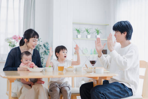 istock A happy family eating dinner together 1420320320