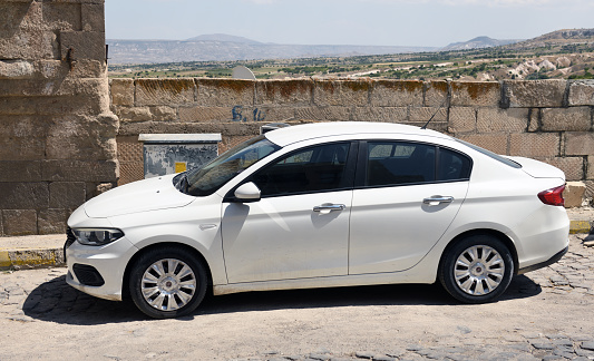Cappadocia, Turkey 11.08.2022:White Fiat Tipo parked in Cappadocia city. The Fiat Tipo is a compact car manufactured by Fiat since 2015.