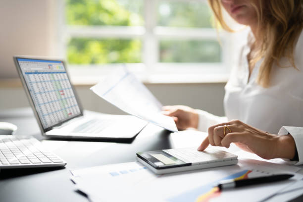 istock Tax Account Using Calculator. Business Ledger Record 1420323107
