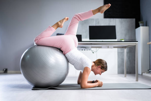 istock Exercise Workout With Fitness Ball 1420323175