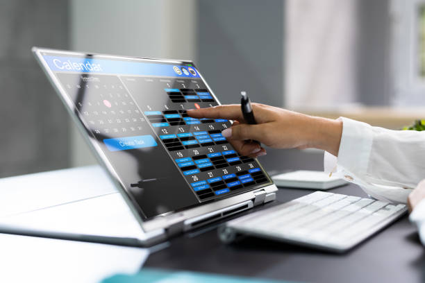 Scheduling And Booking Online Appointment In Calendar Scheduling And Booking Online Appointment In Calendar Using Laptop making a reservation stock pictures, royalty-free photos & images