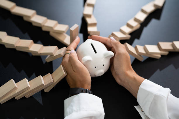 istock Hand Protecting Cash Money 1420323335