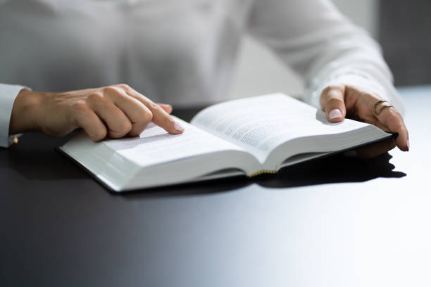 istock Prayer Woman Studying Bible Book 1420323356