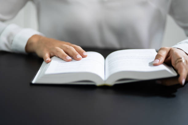 istock Prayer Woman Studying Bible Book 1420323358