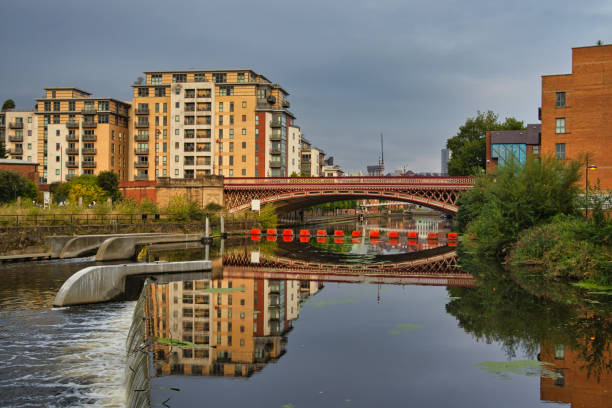 istock Modern apartment block and Crown Point bridge reflected in River Aire, Leeds, West Yorkshire, England, Britain 1420324440