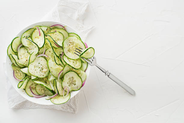 istock Cucumber salad with onion and dressing 1420333160