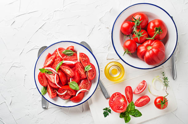 istock Tomato salad with onion and dressing 1420333569