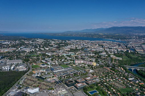 Geneva with the lake Geneva in the background. The image was captured during spring season and shows parts of some business and residential districts.