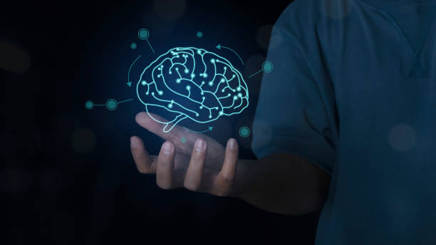 istock Businessman hand holding a brain Virtual Holographic interface. 1420362127