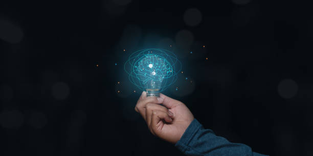 istock Businessman holding light bulb with brain inside, Creative and innovation inspiration. 1420362189