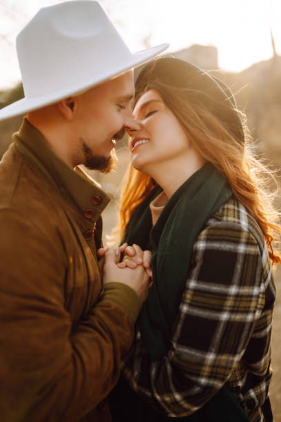 istock Stylish couple walking and hugging in the park. 1420365811