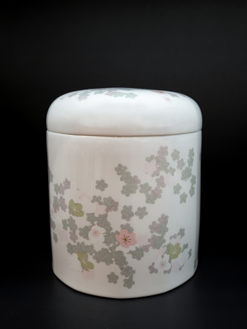 Ceramic bowl with lid, decorated with a floral pattern