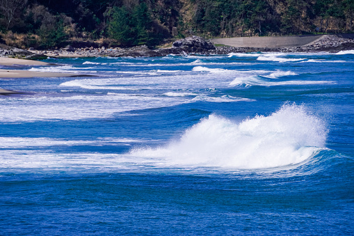 Rough waves of the Sea of Japan on a sunny day in March 2021 at Uno Beach in Yurihama Town, Tottori Prefecture