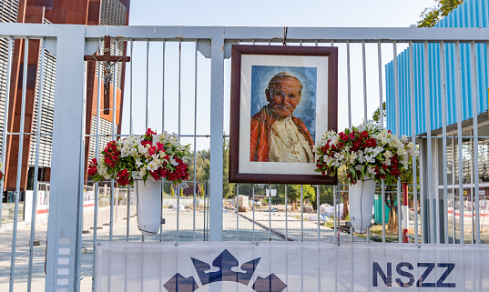 Gdansk, Poland - August 13, 2022: A picture of a small shrine to Pope John Paul II at the entrance of the Gdansk Shipyard.