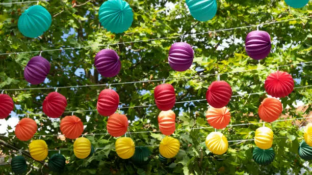 Photo of Colorful paper lanterns at a party in a village in spain