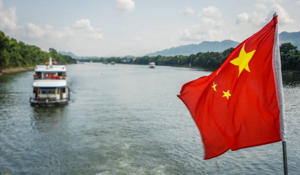 istock Red Chinese national flag on a boat sailing on Li River 1420405385