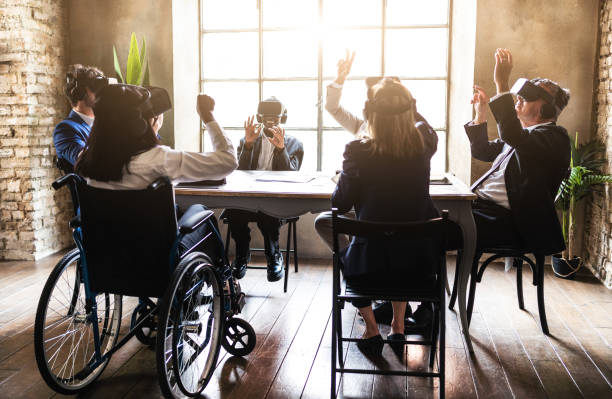 istock Tech and innovative company working with vr glasses and interacting with their clients in metaverse - Back view of group of business person brainstorming on a eco sustainable project 1420417559