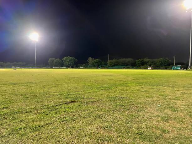 istock Empty green grass playground at night 1420419560