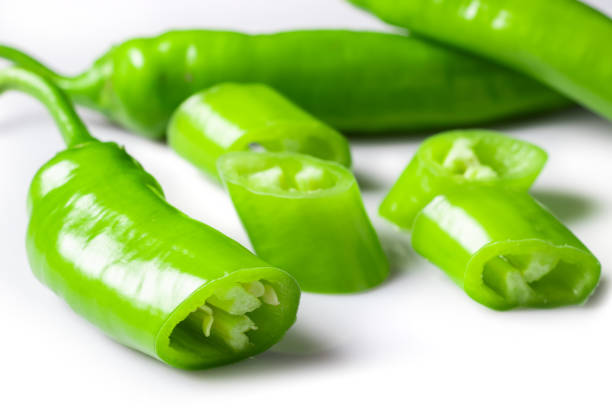 istock green hot chili peppers with slices isolated on white background 1420419975