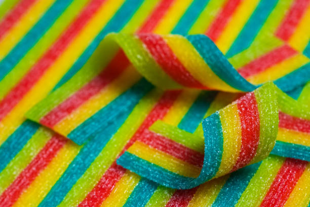 istock Rainbow sour jelly candies strips in sugar sprinkle. 1420420294