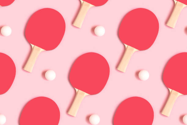 Repetitive pattern made of tennis racket and white ball.
