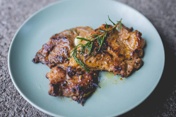istock Round plate with grilled beef steak and rosemary 1420425045