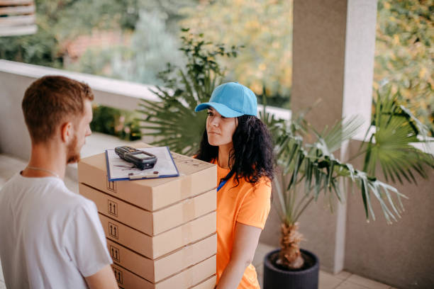 istock Woman delivery person 1420430276