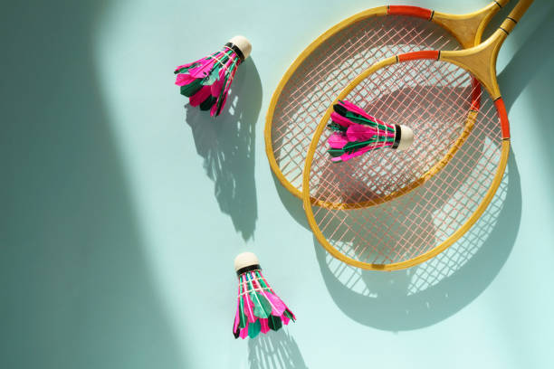 istock Shuttlecock and badminton racket on pastel color blue background 1420431211