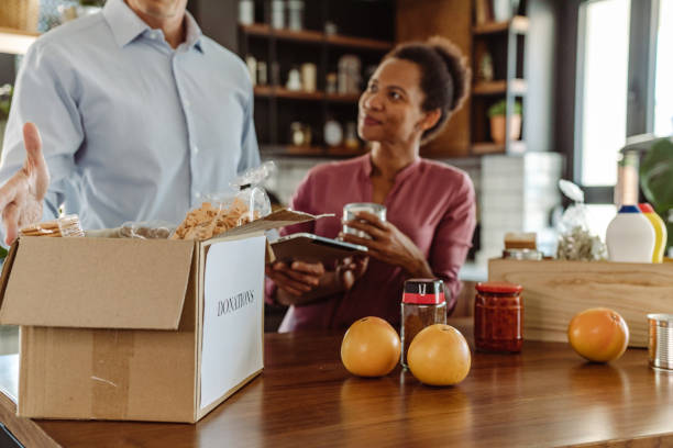 istock Mature couple packing donations 1420432726