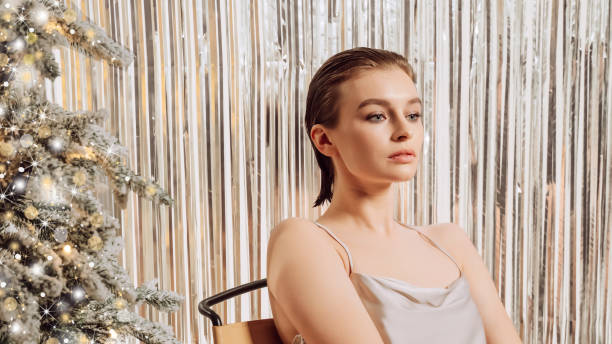 istock Frustrated young woman getting bored at Christmas tree, sitting at home, thinking over problems, feeling lonely, sad, depressed, suffering from apathy, loneliness on Xmas holiday time 1420436755