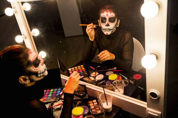istock Face painting in front of a mirror 1420451785
