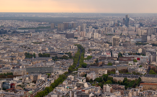 Aerial view of french architecture buildings with Eiffel Tower background. Champs-de-Mars.