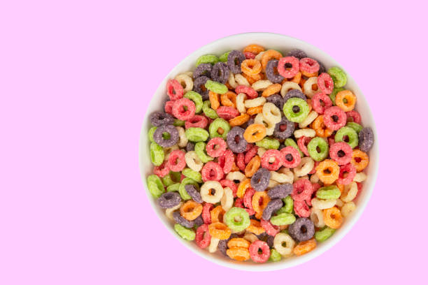 istock Delicious and nutritious fruit cereal loops multicolored flavorful on white background, healthy and funny addition to kids breakfast 1420465805