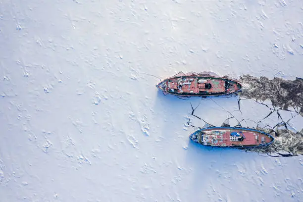 Icebreakers on Vistula river crushes the ice, 2020-02-18, Poland, aerial view