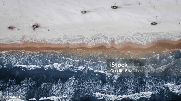 Boats On Snowy Beach In Winter At Baltic Sea Stock Photo - Download Image Now - Arctic, Drone, Fishing Industry