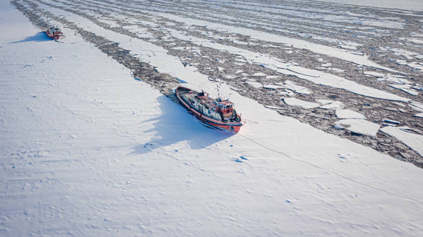 istock Icebreakers on river in winter. Aerial view of frozen river. 1420469606