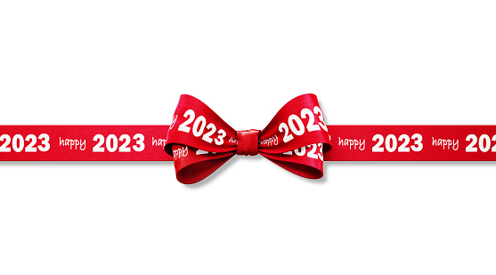 Happy 2023 written red tied bow ribbon sitting over white background. Horizontal composition with copy space. Happy 2023 concept.