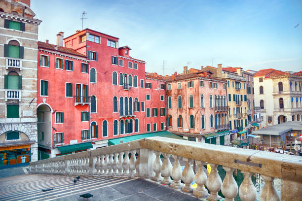 Rialto Bridge over Grand Canal at sunrise in Venice, Italy