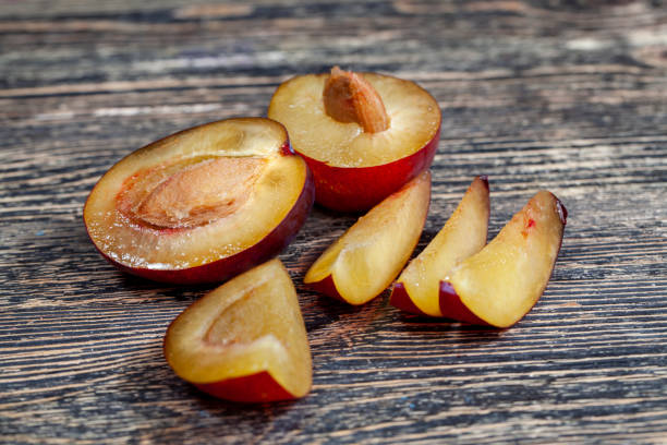 istock Ripe plum on a wooden table 1420479060