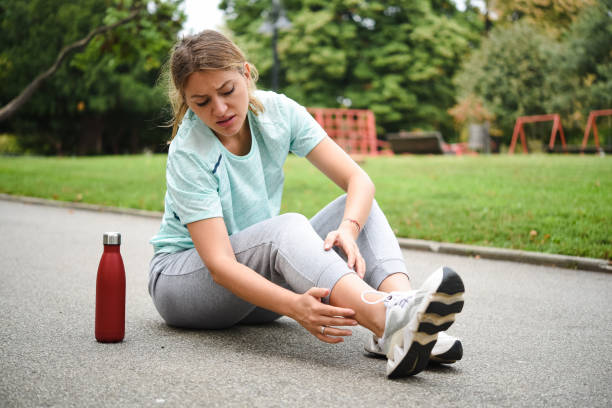 istock Woman fell while jogging and sprained her ankle 1420486421