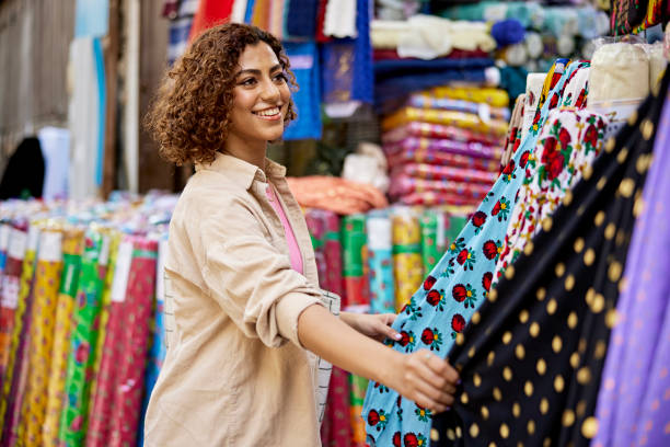 istock Cheerful young Middle Eastern woman shopping at local souk 1420486914