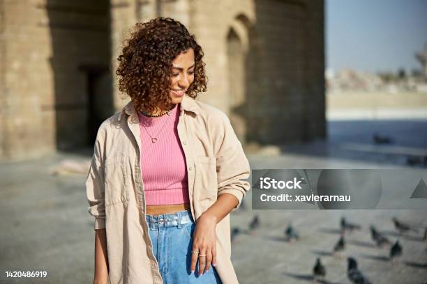 Relaxed Young Woman Outdoors At Baab Makkah In Jeddah Stock Photo - Download Image Now
