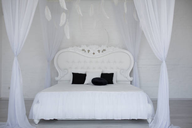 istock Cozy bedroom area at luxury studio apartment with a free layout and big panoramic window. 1420487485