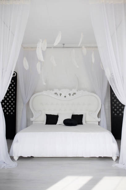istock Cozy bedroom area at luxury studio apartment with a free layout and big panoramic window. 1420487633