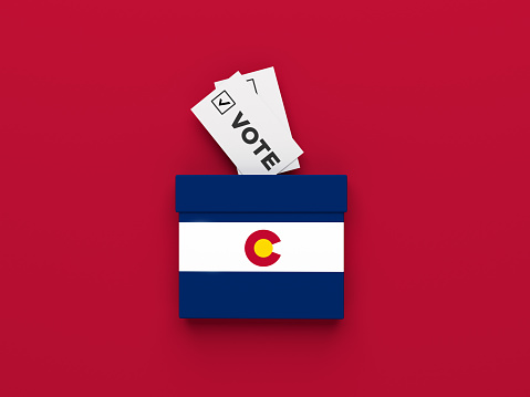 American election concept. Colorado election vote box on red color background. Horizontal composition. Isolated with clipping path.