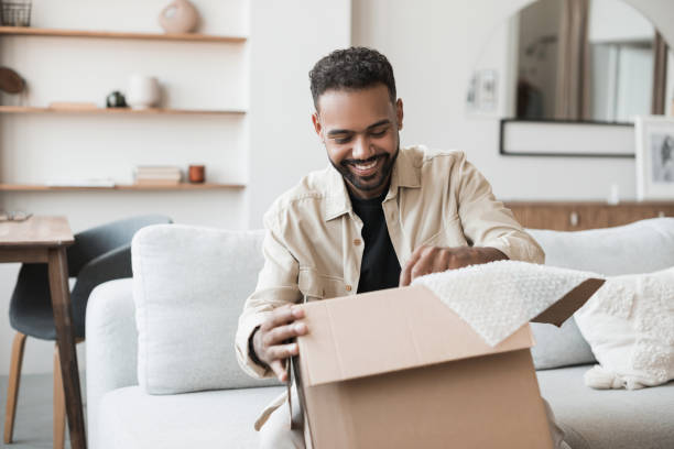 istock Happy man opening parcel. Delivery concept 1420488654