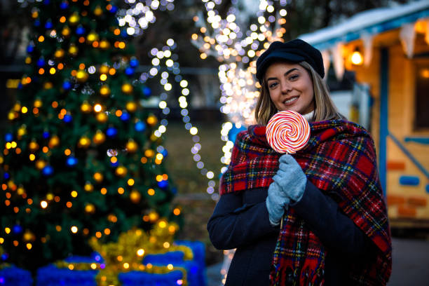 istock Public park with woman holding a lollipop 1420488683
