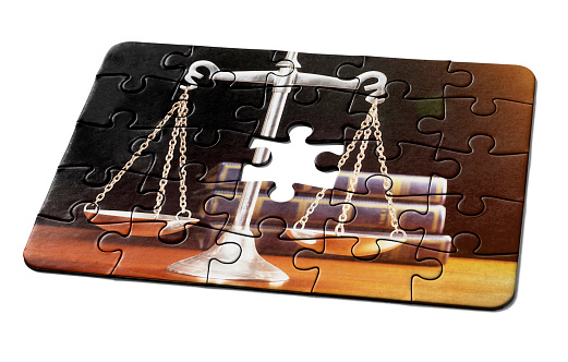 Jigsaw puzzle needs the final piece as a solution to a problem or challenge involving law, justice or the courts.