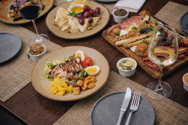 istock Italian appetizer - various types of ham, cheese and grissini 1420506731