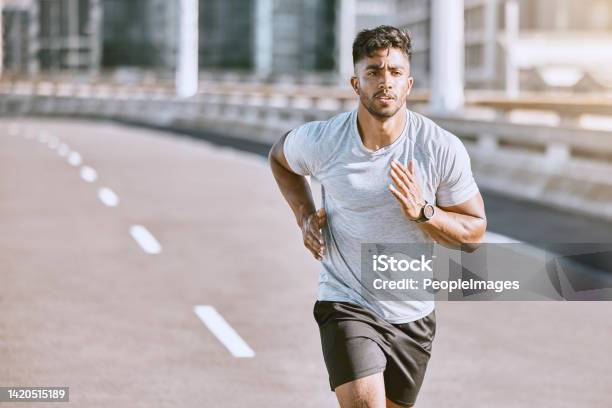 Exercise Workout And Training With A Healthy Man Training For Sport Fitness And Wellness Outside In The City Running Exercising And Working Out With Motivation For Lifestyle Health And Sports Stock Photo - Download Image Now
